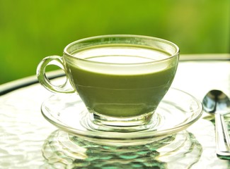 green tea in the morning on green background