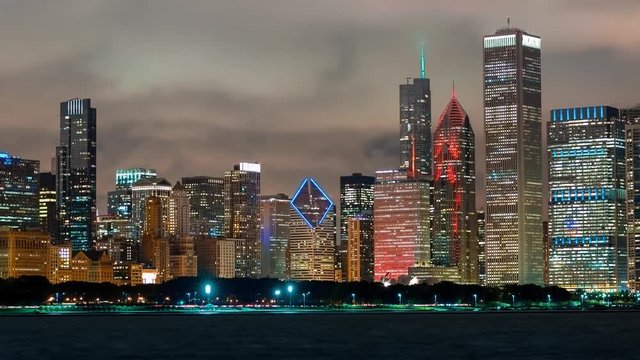 Time-laspe of the Chicago skyline at night with Lake Michigan in the foreground