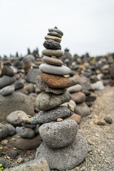 A pile of pebbles is built in the form of a pyramid.