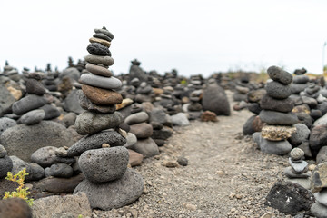 A pile of pebbles is built in the form of a pyramid.