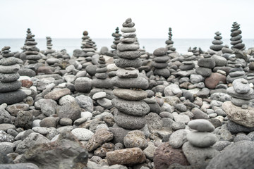 Fototapeta na wymiar A pile of pebbles is built in the form of a pyramid.
