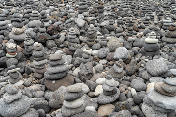 A pile of pebbles is built in the form of a pyramid.