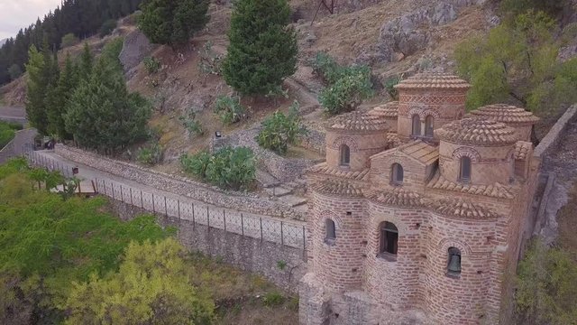 Stunning 4k backwards aerial, church in Stilo, in the valleys of Calabria, Italy