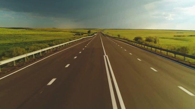 Flying over the empty road. Aerial view 4 k