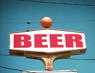 aged and worn vintage beer sign
