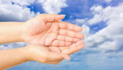 human hand gesture something with sky background