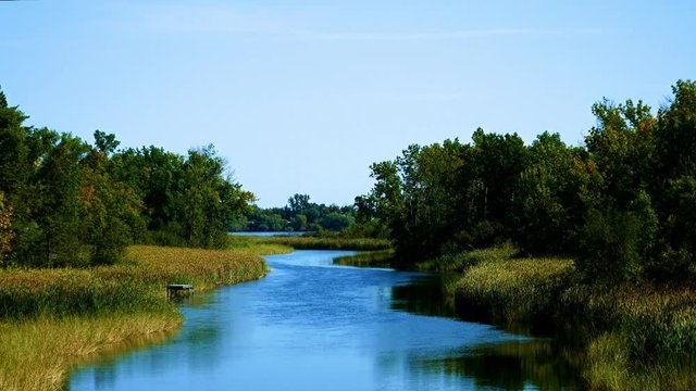 Mississippi River flows north toward Bemidji Minnesota near hiway 2. This scene is a few miles from the source at Lake Itasca