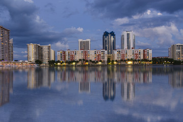 Fototapeta na wymiar Miami Skyline with canal reflection during night time