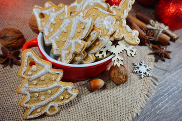 Decorative Christmas cookies, almonds, nuts, cinnamon and anise stars.Christmas sweets and nuts.
 ...