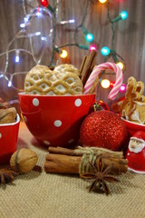 Decorative Christmas cookies, almonds, nuts, cinnamon and anise stars.Christmas sweets and nuts.
 ...