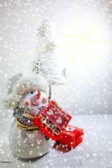  The magic of Christmas - Christmas gift and snowman
