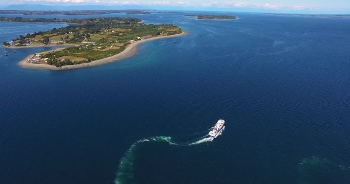 Ship sailing. Islands in the background