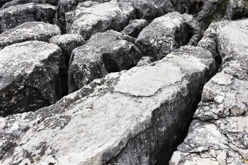 background image, texture of large gray stones, long stones, with deep cracks