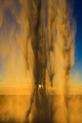 Behind of waterfall with sunset