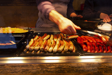 many different sausages and French fries, fast food on the street, national food at fairs and festivals, great for beer