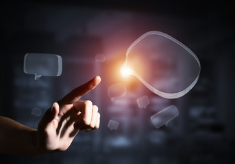 Concept of communication by glass empty chat icon on gray background. Mixed media