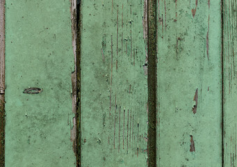 background old faded and cracked wooden planks green