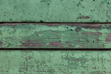 background old faded and cracked wooden planks green