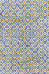 background image of old colorful Portuguese tiles Azulejos, historical patterns, covering the old house in Portugal