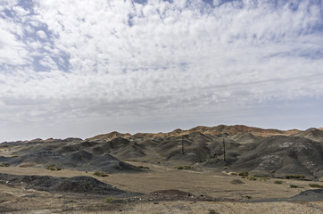 Desert and mountain over blue sky and white clouds on altiplano