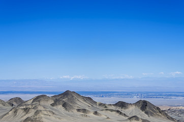 Desert and mountain over blue sky and white clouds on altiplano