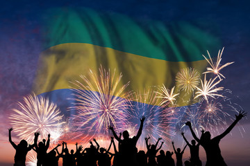 People are looking on fireworks and flag of Gabon