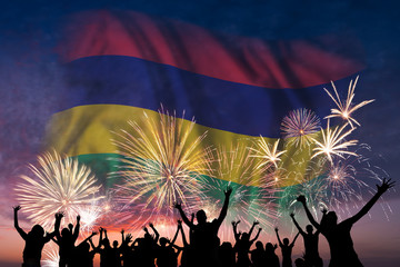 People are looking on fireworks and flag of Mauritius
