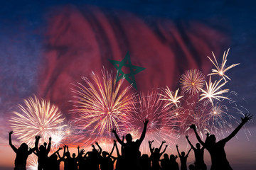 People are looking on fireworks and flag of Morocco