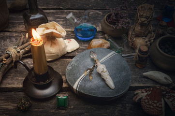 Magic potion in the vial on the wizard table. Witchcraft concept.