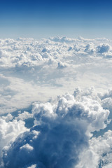 Sunny view of atmosphere above the clouds in Europe.