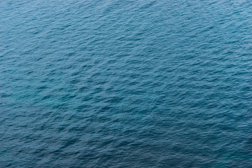 Ripples on the surface of blue water of the Black Sea top view of a natural background