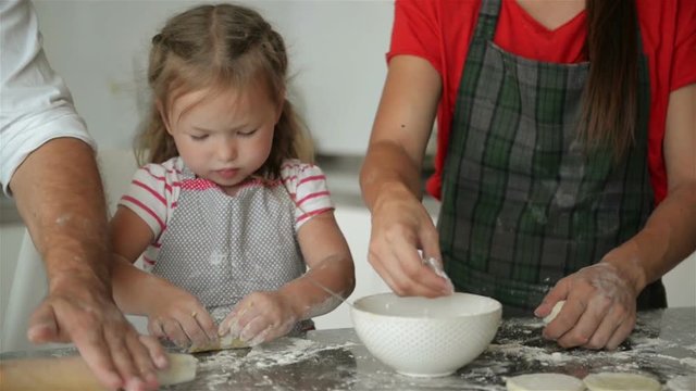 Young Parents Are Learning Their Daughter's Cooking. They Show All The Cooking Processes.