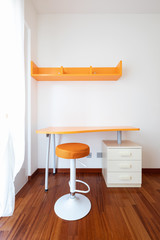 Fototapeta na wymiar Orange desk and stool detail