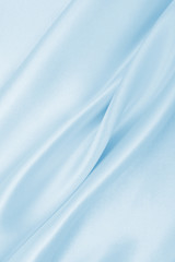 Smooth elegant blue silk or satin luxury cloth texture as abstract background. Luxurious background...