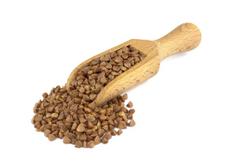 Buckwheat on wooden scoop isolated on white background