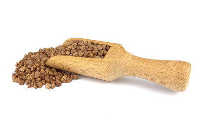 Buckwheat on wooden scoop isolated on white background