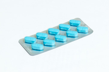 One  new pack of 10 blue oblong pills isolated on a white background