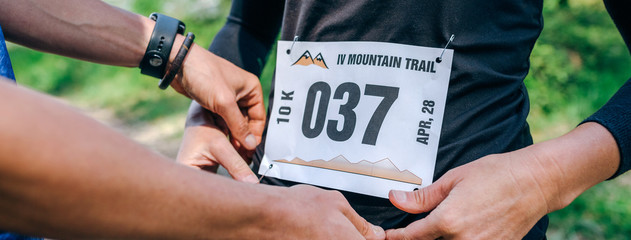 Girl placing the race number