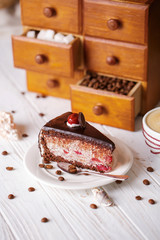A piece of chocolate cake with cherries