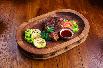 Hot steak with sauce and vegetables. Snacks for beer at the restaurant