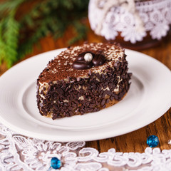 A piece of coffee cake with a white pearl