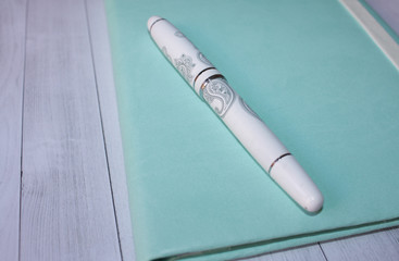 Fototapeta premium pen on notebook