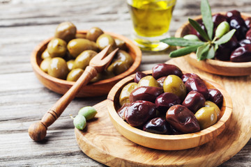 Bowls with marinated olives. Mediterranean snack or appetizer.