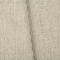 Fototapeta premium Soft linen fabric for sewing clothes. Texture canvas fabric as background. Texture fabric for feminine and men's shirts from flax.