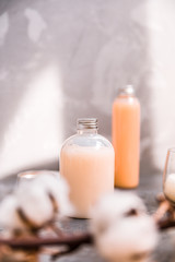 Natural spa cosmetics on a dark blue beton concrete background. Beauty blogger, minimalism concept, copy space