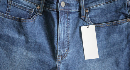 Blue jeans with blank white price label tag