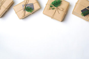 Obraz na płótnie Canvas Christmas Gifts with Fir Branches on White Background