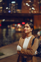 Fototapeta premium woman walking near Chicago river