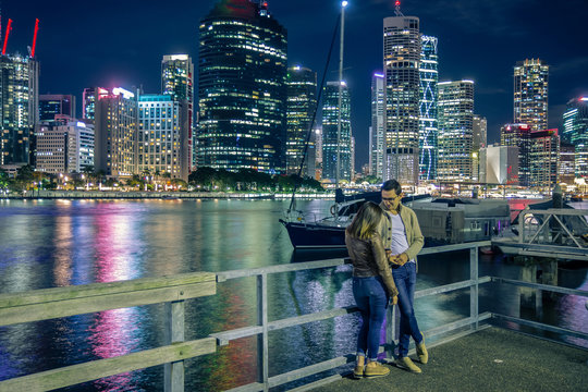 Couple standing on pier in Brisbane