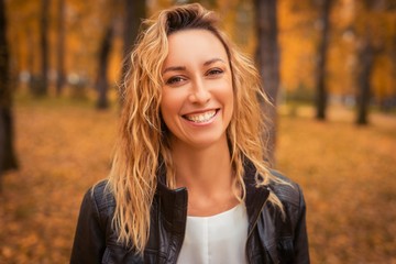 Portrait of a girl in the autumn park.